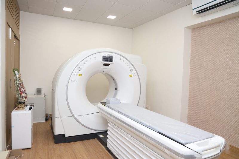 CT room at AV Scan Diagnostics, Dadar West: the scanner ring and its table in a bright, clean room