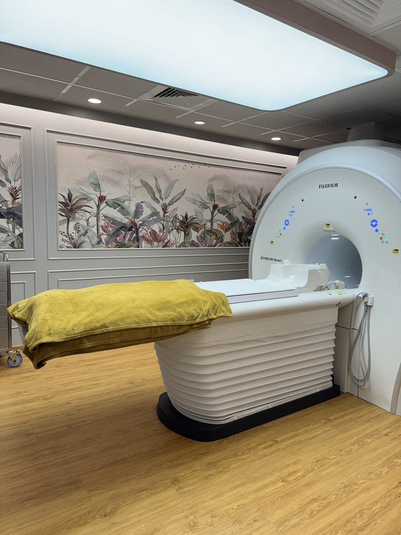 MRI room at AV Scan Diagnostics, Dadar West: the scanner table with a folded blanket in front of the wide-bore opening